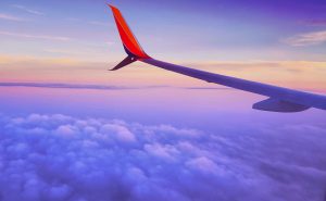 Plane wing above clouds