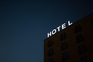 Dark image with 'Hotel' in lights